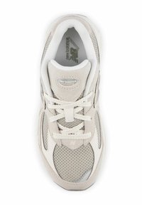 Light gray sneaker with mesh and suede materials. Features a round toe, lace-up front, and textured accents. Subtle branding visible.