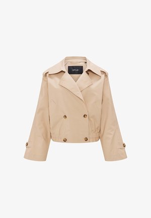 Beige kurz geschnittene Jacke aus leichtem Stoff mit doppelter Knopfleiste, großen Revers und Knopfakzenten an den Ärmeln. Elastischer Saum am Bund.