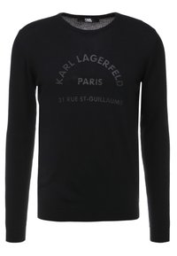 Svart långärmad tröja i stickat tyg, med rund halsringning och upphöjd text: "KARL LAGERFELD PARIS 21 RUE ST-GUILAUME."
