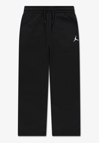 Pantalon de survêtement en coton noir avec une taille élastique et un cordon de serrage. Présente un logo Jordan blanc sur la cuisse gauche. Texture lisse.