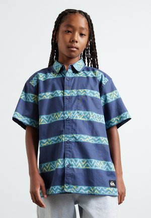 Korte mouwen button-up shirt in marineblauw met afwisselende geweven patronen in turquoise en geel. Beschikt over een borstzak en een logotag aan de zoom.