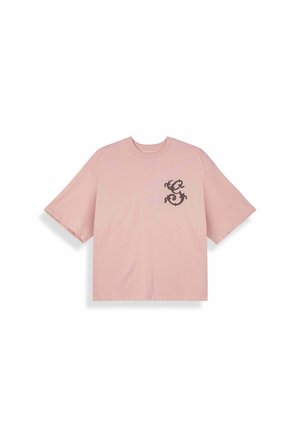 Różowy t-shirt z krótkim rękawem i okrągłym dekoltem, z czarną stylizowaną grafiką smoka na lewej piersi.