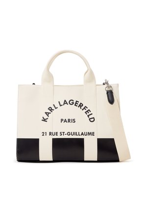 Bolso tote crema y negro de Karl Lagerfeld con asas dobles, correa de hombro desmontable y texto de la marca que incluye "París" y "21 Rue St-Guillaume".
