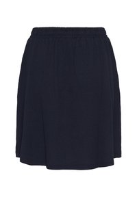Jupe bleu marine en tissu léger, dotée d'une taille élastique et d'un design évasé pour faciliter le mouvement.