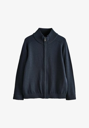 Marineblå strikket sweater med lynlås, høj ribstrikket krave, lange ærmer samt ribstrikkede manchetter og kant.