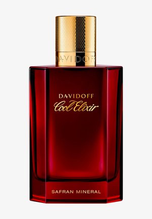 Flacon de parfum rectangulaire rouge étiqueté « Davidoff Cool Elixir Safran Mineral » avec un bouchon en or texturé.