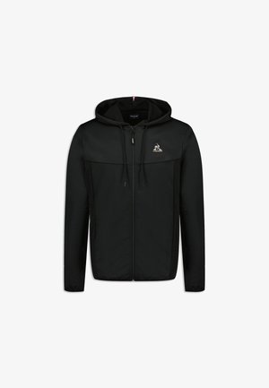 Black zip-up hoodie with a drawstring hood, featuring a tonal upper panel and logo detail on the chest. Smooth fabric texture.