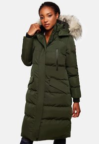Green puffer coat with a faux fur hood, zippered chest and side pockets, ribbed cuffs, and a long design. Textured, insulated material.