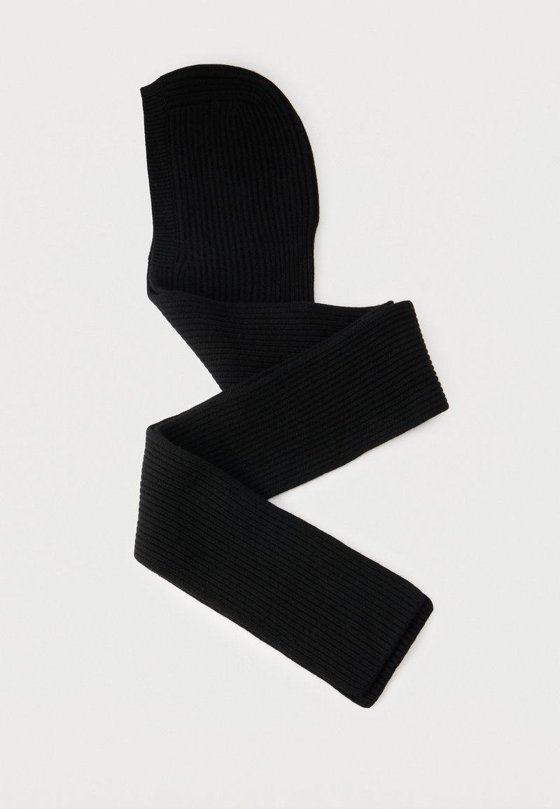 Svarta ribbade leggings med en mjuk textur, med hög midja och sömlös kant för en bekväm passform.