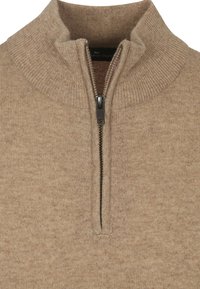 Beige ritsvest gemaakt van zachte stof, met een hoge kraag, geribbelde accenten en een centrale rits met een metalen trekker.