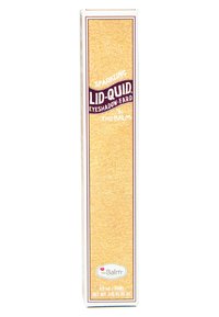 Goudkleurige rechthoekige verpakking voor The Balm's Sparkling Lid-Quid oogschaduw. Kenmerkt een gestructureerd oppervlak, opvallende letters en gedetailleerde accenten.