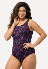 Musta yksiosainen uimapuku, jossa on värikäs, abstrakti kuvio päällekkäisistä muodoista punaisena, purppurana ja valkoisena. Leveät olkaimet.