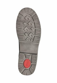 Semelle en caoutchouc avec une surface texturée, de couleur grise et un accent circulaire rouge. Les motifs comprennent des crêtes et des formes de diamant pour améliorer l'adhérence.
