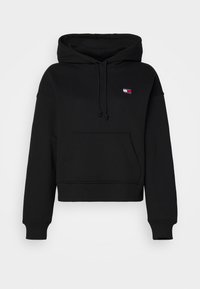 Sweat à capuche noir avec poche kangourou à l'avant, capuche à cordon, poignets et ourlet côtelés, et petit logo Tommy Jeans sur la poitrine.
