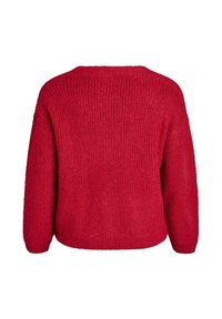 Rdeča pletena pulover s teksturirano površino, z nižjimi rameni in sproščenim krojem. Ima okroglo ovratnico in rahlo skrajšan zadnji rob.
