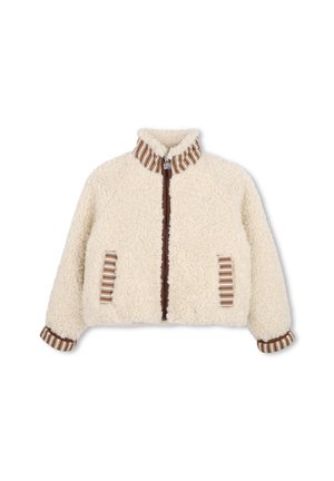Veste en polaire couleur crème avec bordure rayée marron et blanche au col, aux poignets, aux bords des poches et sur la zone de la fermeture éclair avant.
