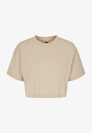 Beskåret beige t-shirt i blødt bomuld, med rund hals og korte ærmer, med ren syning og ingen synlige mønstre eller detaljer.