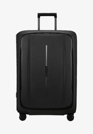 Black hard-shell suitcase with a sleek design, vertical textured lines, a retractable handle, and four smooth-rolling wheels.