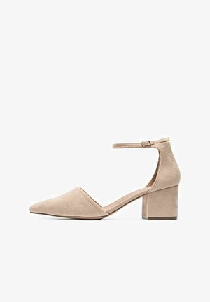 Bežīgi zamšādas apavi ar blokveida papēdi, ar vērsti uz galu, potītes siksniņu un strukturētu virsmu, ar vidēju papēža augstumu un elegantu siluetu.