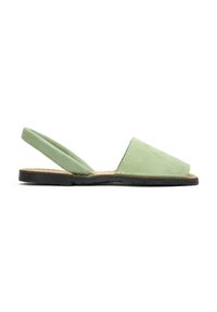Green suede slingback sandals with a flat black sole, featuring an open toe design and angled cutouts on the sides.