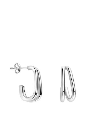 Silver hoop earrings with a polished finish, featuring a curved, tubular design and a post-back closure. Distinctive wavy lines add texture.