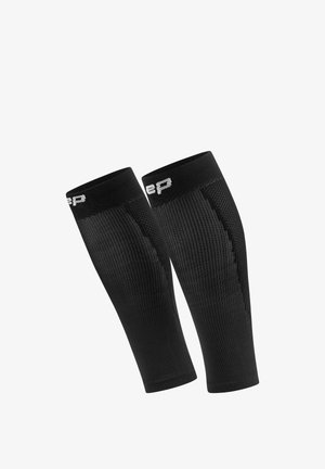 Paar schwarzer Kompressions-Kniestrümpfe mit gerippter Textur und weißem Teil-Logo oben, auf weißem Hintergrund isoliert.