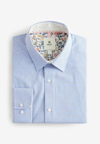 Camicia a maniche lunghe blu e bianca con motivo, dotata di colletto classico, con stampa floreale all'interno del colletto e dei polsini. Materiale in cotone.