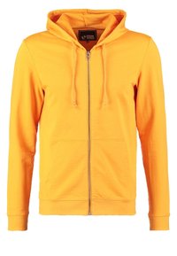 Sudadera con capucha amarilla con cremallera, hecha de tela suave, que cuenta con una cremallera frontal, una capucha ajustable y dos bolsillos laterales. Textura lisa.