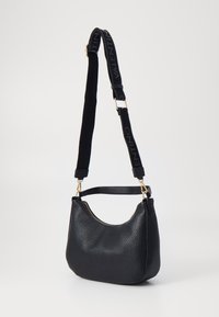 Black leather handbag with a pebbled texture, curved shape, and gold hardware. Features a black fabric strap with "VALENTINO" logo.