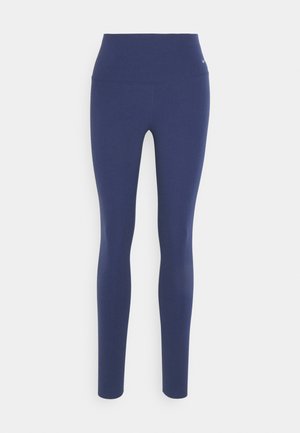 Leggings bleu marine avec taille haute, fabriqués en tissu doux et extensible, dotés d'un design sans couture et sans matériel ou accents visibles.
