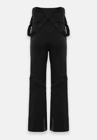 Pantaloni da neve neri a vita alta con bretelle incrociate e regolabili, aree rinforzate sulle ginocchia e sulle caviglie, progettati per attività invernali all'aperto.