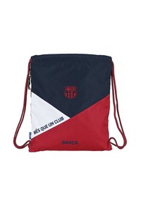 Sac à dos à cordon en tissu bleu marine, rouge et blanc. Présente le texte "MÉS QUE UN CLUB", le logo du club et des panneaux de couleur contrastée.