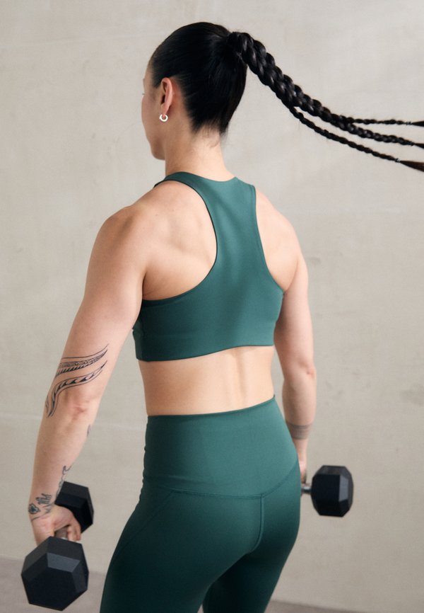 DYLAN - Medium support sports bra - moss