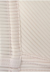 Tissu beige clair avec des rayures verticales et une surface texturée. Présente des coutures visibles et un léger éclat.