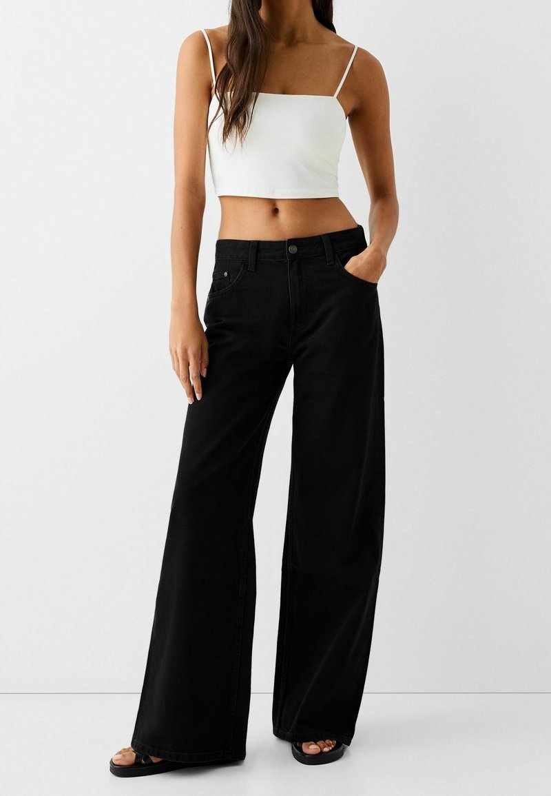 Bershka Jeans a zampa black/nero (Second hand)