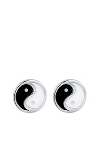 Yin-yang studs, sølvmetal med sort og hvid emalje, cirkulær form med dobbelte kontrasterende designs og små cirkulære accenter.