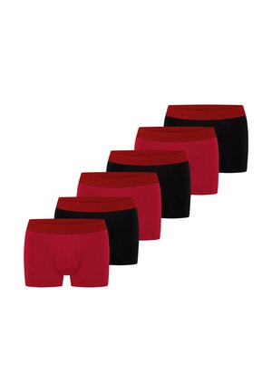Six pairs of men's boxer briefs alternating red and black colors, arranged in a diagonal line on a white background.