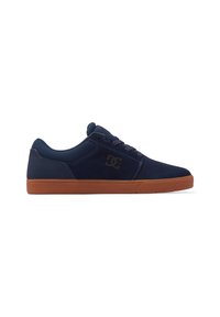 Navy blue suede skate shoes with a rubber brown sole, featuring a black logo on the side and laces for secure fastening.