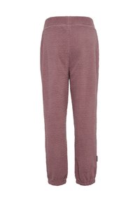 Fleece pants in mauve with a soft texture and elastic waistband. Designed with tapered ankles and a tag on the side.