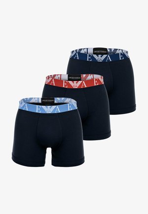 Three pairs of navy boxer shorts with elastic bands. Bands feature the Emporio Armani logo in blue and red, with a textured finish.