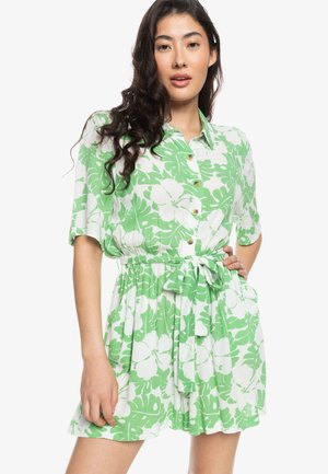 Green and white floral patterned shirt dress with short sleeves, a button-down front, and an elastic waist with a belt. Lightweight fabric.