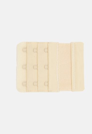 Beige BH-Verlängerung mit vier Haken und Ösen, weichem Stoff, elastischen Bändern und genähten Kanten für zusätzliche Haltbarkeit.