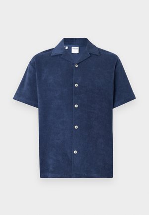 Camicia a maniche corte in terry blu navy, con colletto a punta e cinque bottoni bianchi rotondi sul davanti. Tessuto liscio.