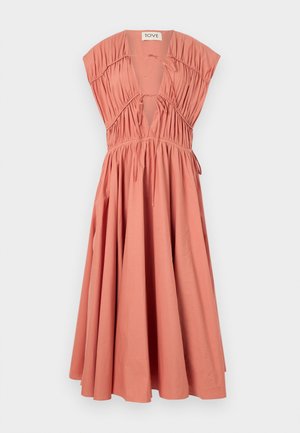 Haljina breskvaste boje s kratkim, strukturiranim rukavima, nabranim gornjim dijelom, dubokim V-izrezom, detaljem za vezanje i lepršavom suknjom. Pamuk.