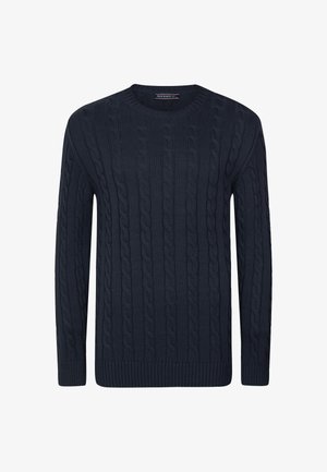 Tumedat sinine koonusstruktuuriga sviiter ümmarguse kaelusega ja soonikkoes varrukatega. Omab tekstuurset mustrit ja lõdva istuvusega.