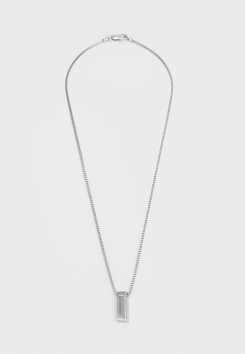 Silver chain necklace with a rectangular pendant. The chain has a delicate, textured design, and the pendant features a linear cutout detail.