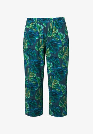 Pantalones cortos con cintura elástica y estampado de hojas tropicales de monstera en verde y azul sobre fondo verde azulado oscuro.
