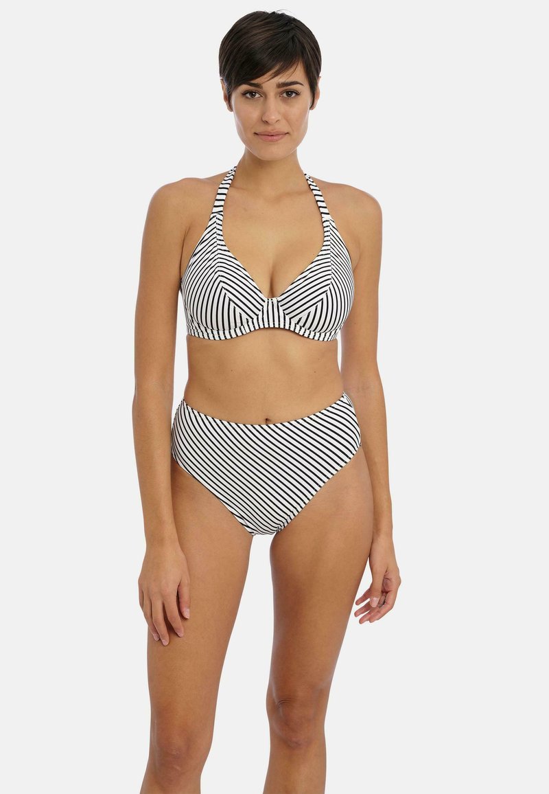 Bikini à rayures noires et blanches avec un design à col halter, un détail torsadé au niveau de la poitrine et une taille haute. Texture de tissu lisse.