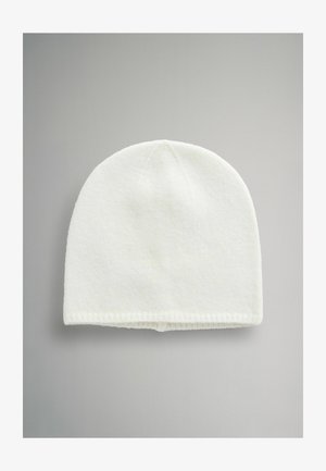 Bílá pletená čepice s kulatým vrchlíkem a žebrovaným lemem. Materiál je měkký s jemnou strukturou, vhodný pro chladné počasí.