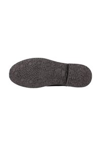 Suola di una scarpa nera con texture, dotata di grip circolari e perforazioni, con il nome del marchio Geox su un'etichetta rettangolare.